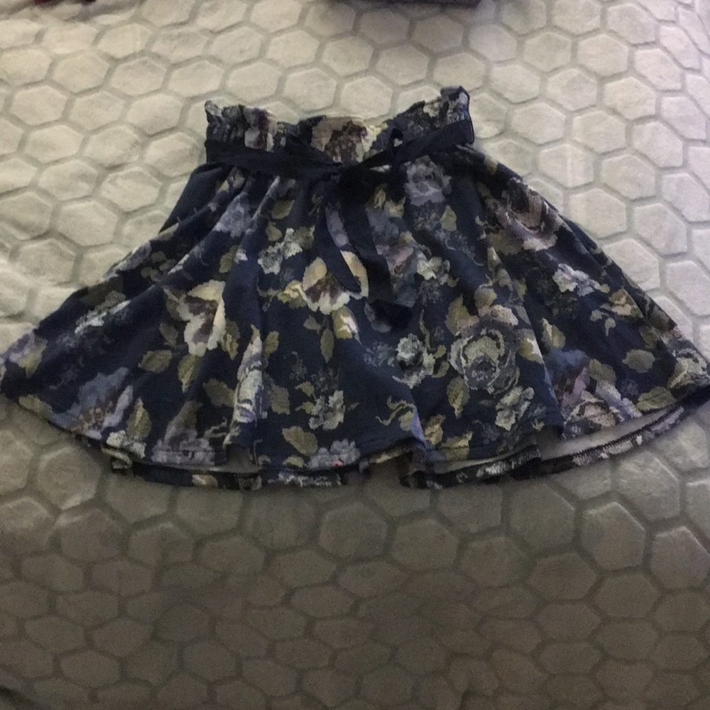 Blue floral mid-length skirt.